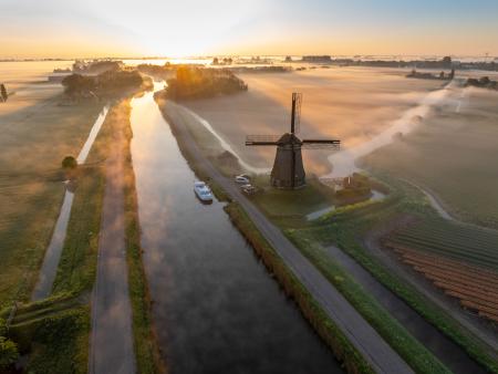 Aerial view of windmill at dawn