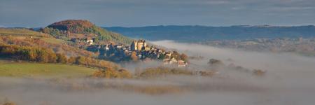 Curemonte in the morning mist in the autumn, Correze, Nouvelle-aquitaine, France