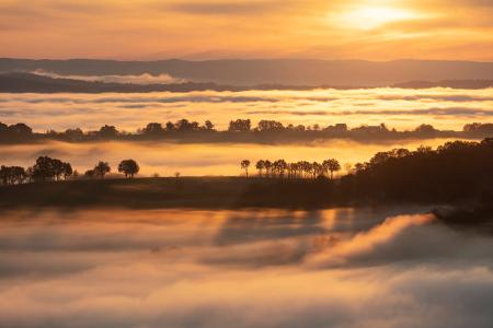 Misty morning in Turenne at sunrise, Correze, France