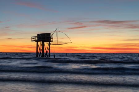Stilt fishing hut at sunset, Atlantic Coast, France