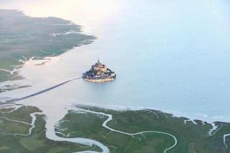 Aerial view of Mont Saint Michel during the spring tide, Normandy, France