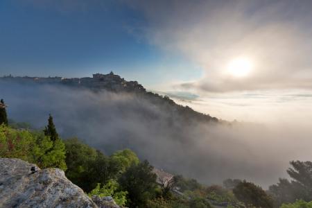 Gordes in the mist at sunrise, Provence, France