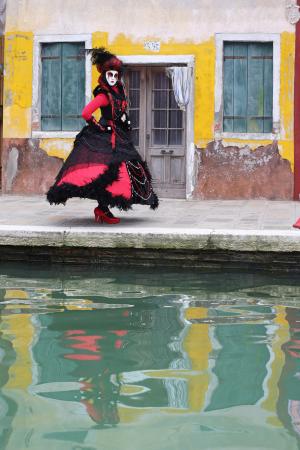 Reflection of the woman in red