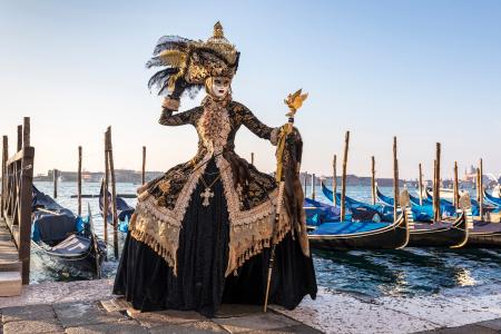 Striking costume by the lagoon during the Venice Carnival